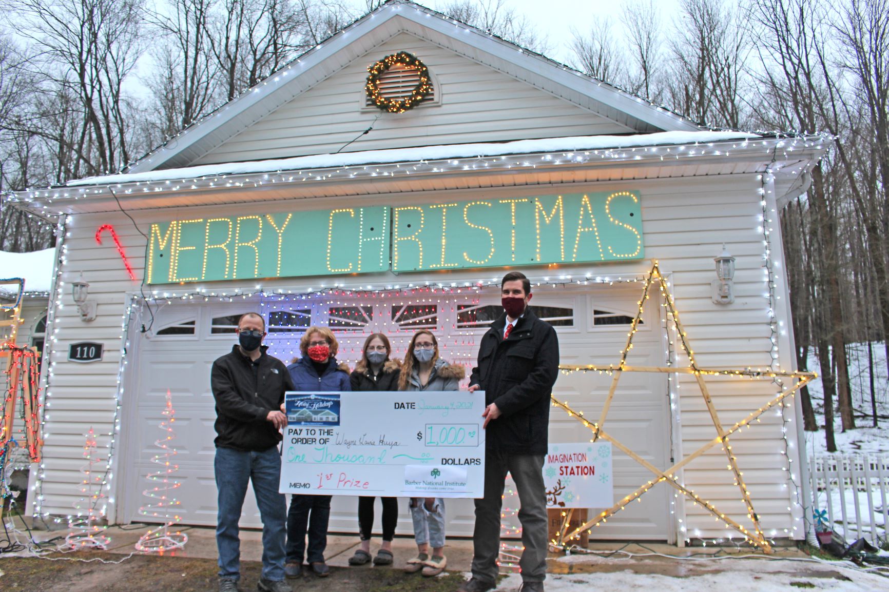 Awarding first place house display winners with check