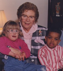 Dr. Gertrude Barber holding kids | Barber National Institute